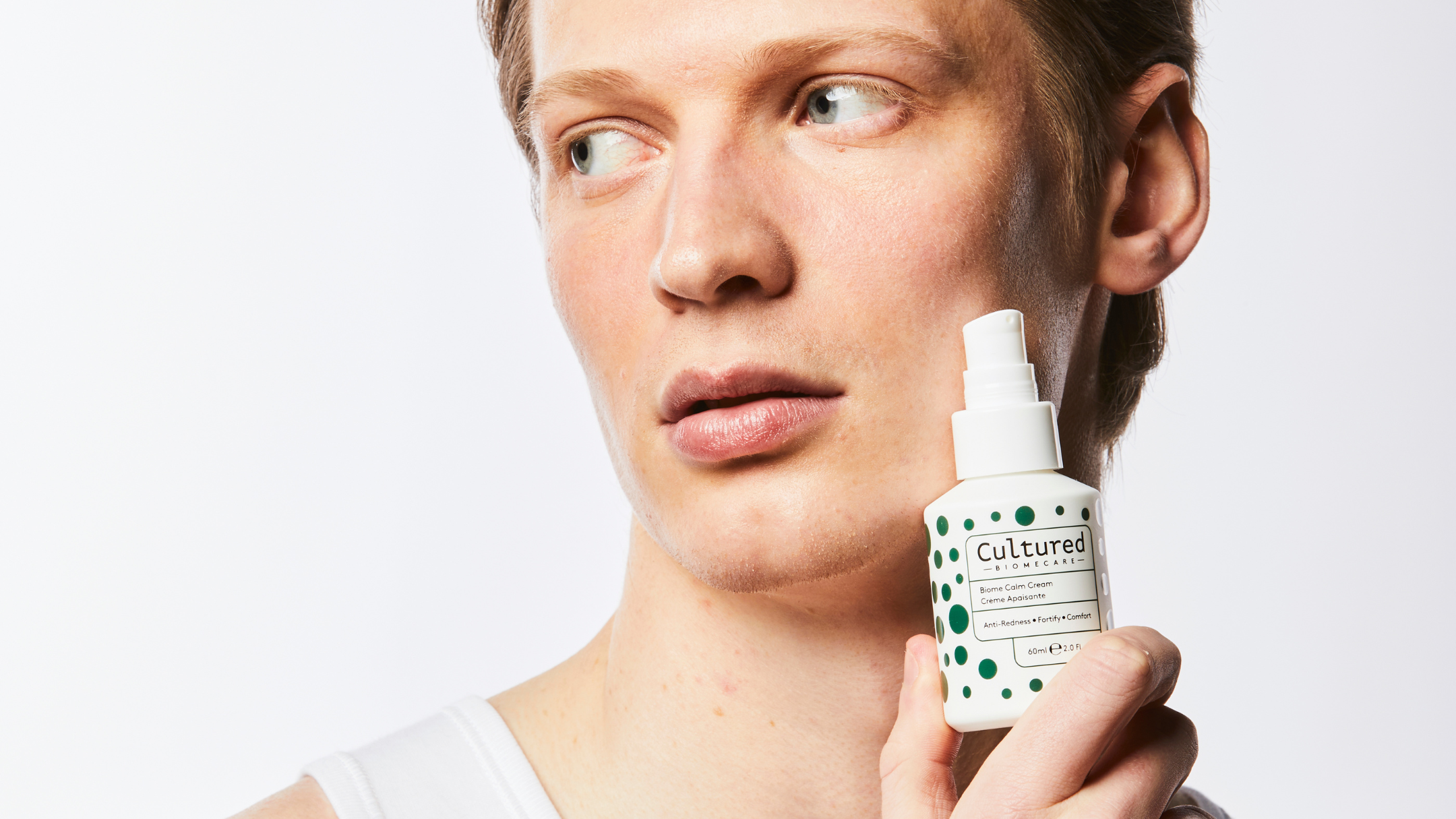 Male model holding beauty product